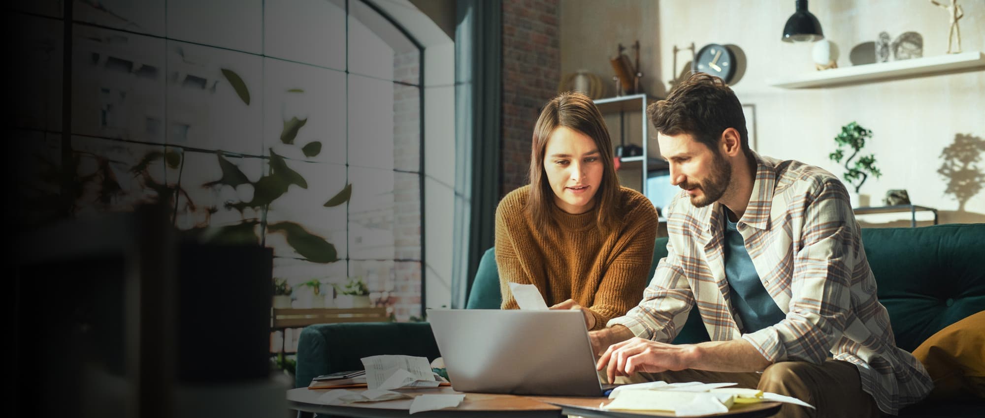 Man and woman looking at laptop.