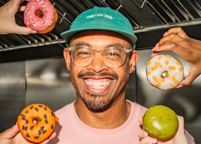 Ryan Panchoo, Founder, Borough 22 - smiling with doughnuts around his head