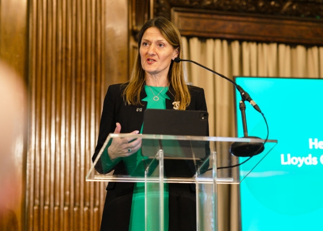 Speaker presenting at lectern