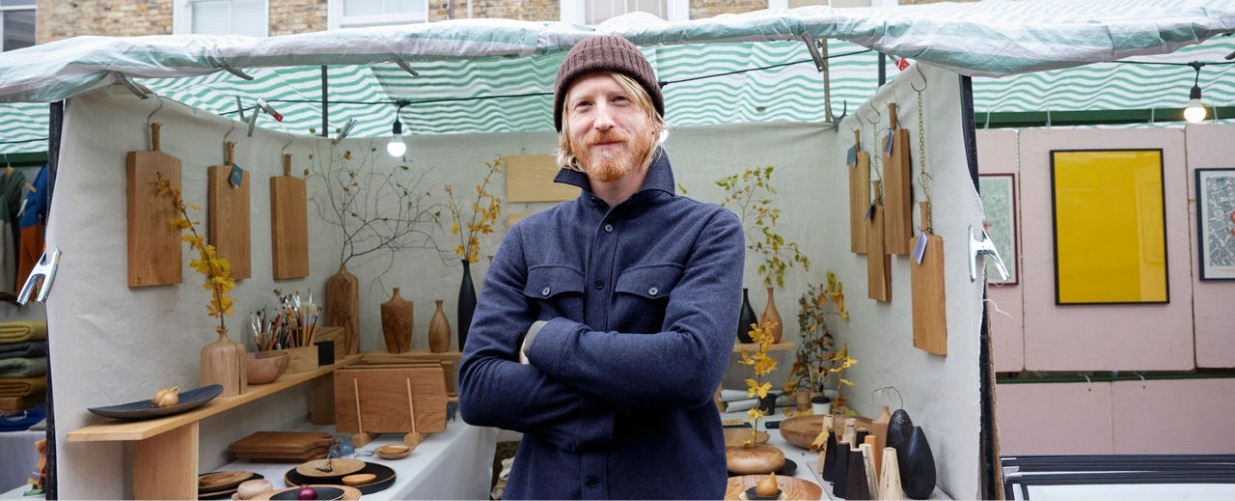 Portrait of a man working on a London street market