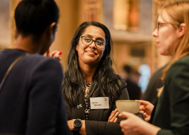 Attendees networking at conference