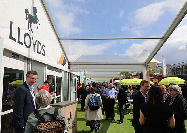 Delegates networking outside the Lloyds Building Futures pavilion at UKREiiF 2026.