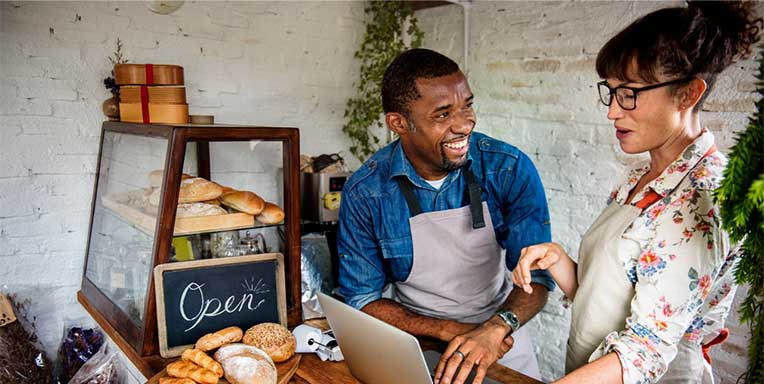 Man and woman running a bakery