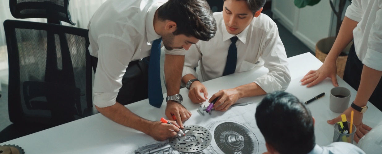 People working over a desk