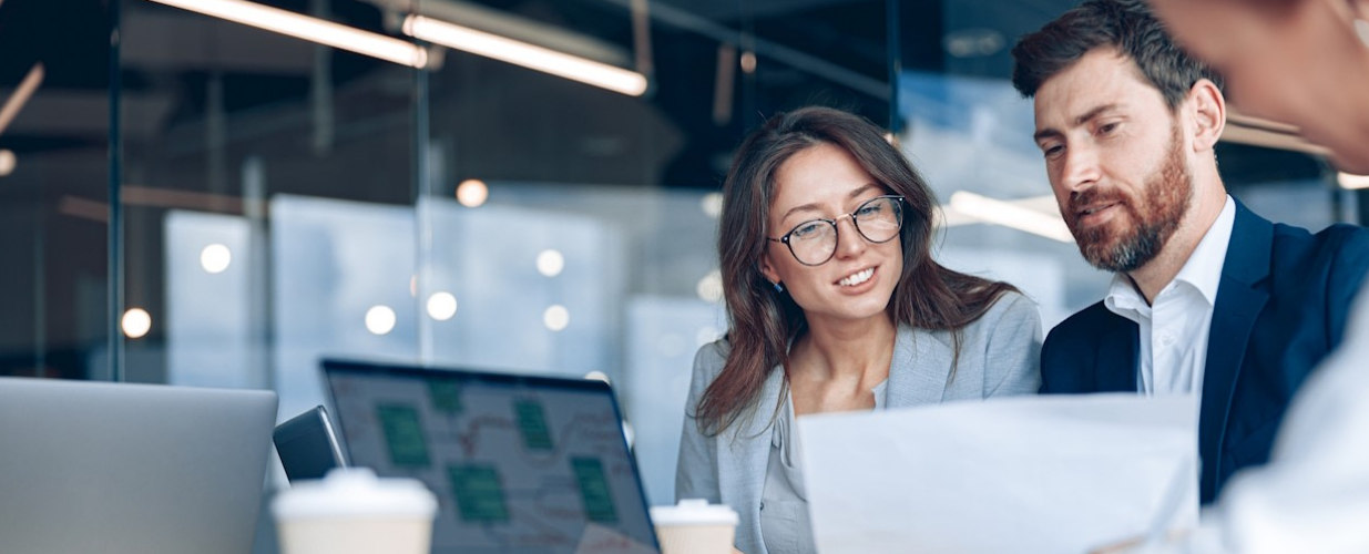 Business people reviewing documents at a desk