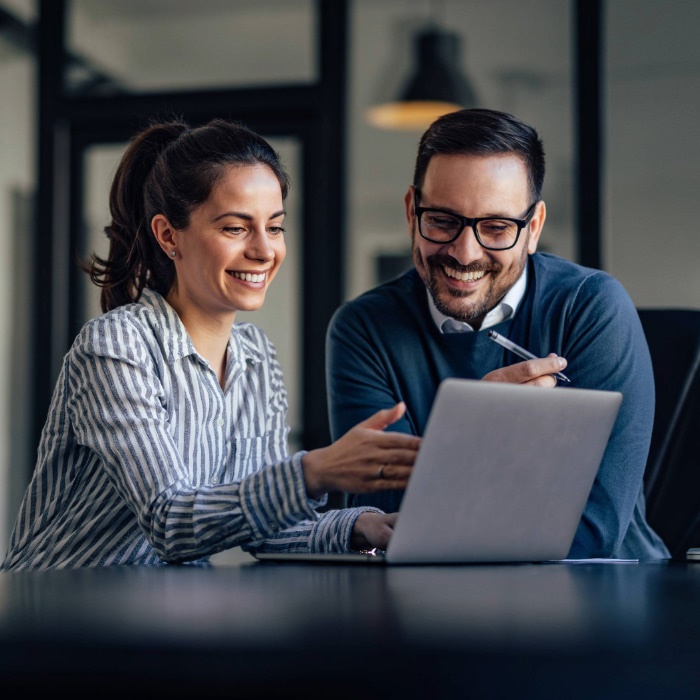 People collaborating at a computer 