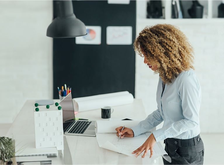 Woman writing notes on paper