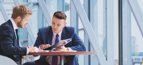 A Relationship Manager having a meeting with a client in an office lobby.