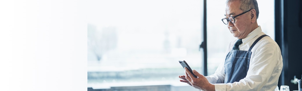 Businessman looking at mobile phone