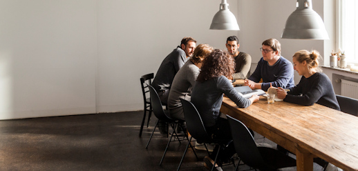 Group of consultants sitting around the table