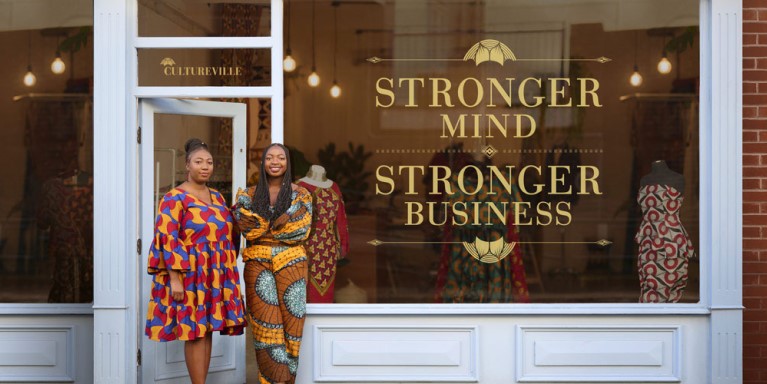 Two women stood outside a store