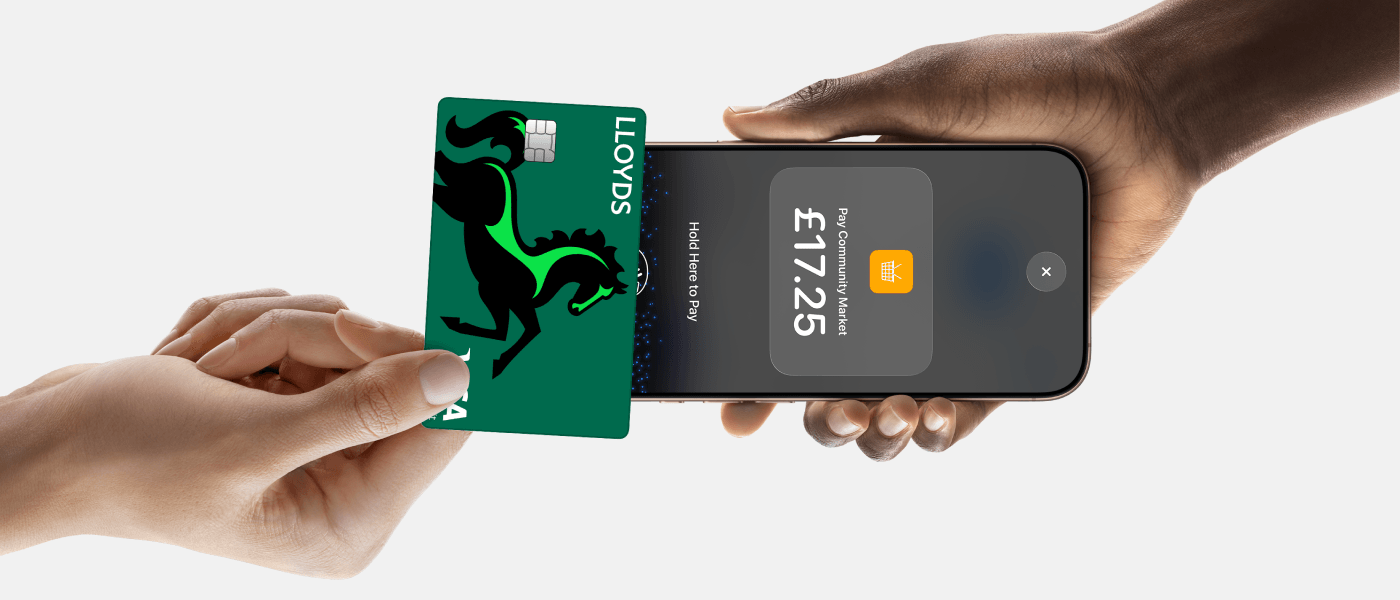 Person accepting contactless payment on iPhone with Lloyds Accept.