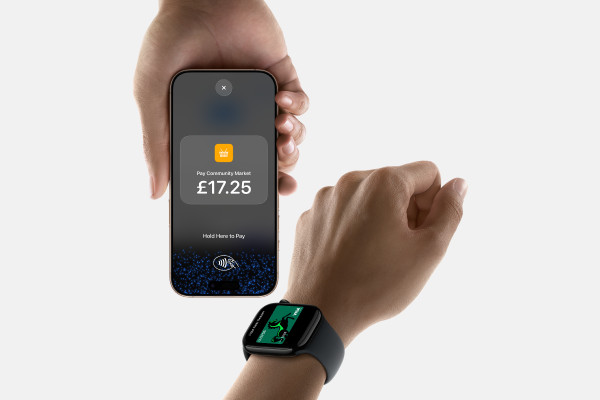 Person accepting contactless payment on iPhone with Lloyds Accept.