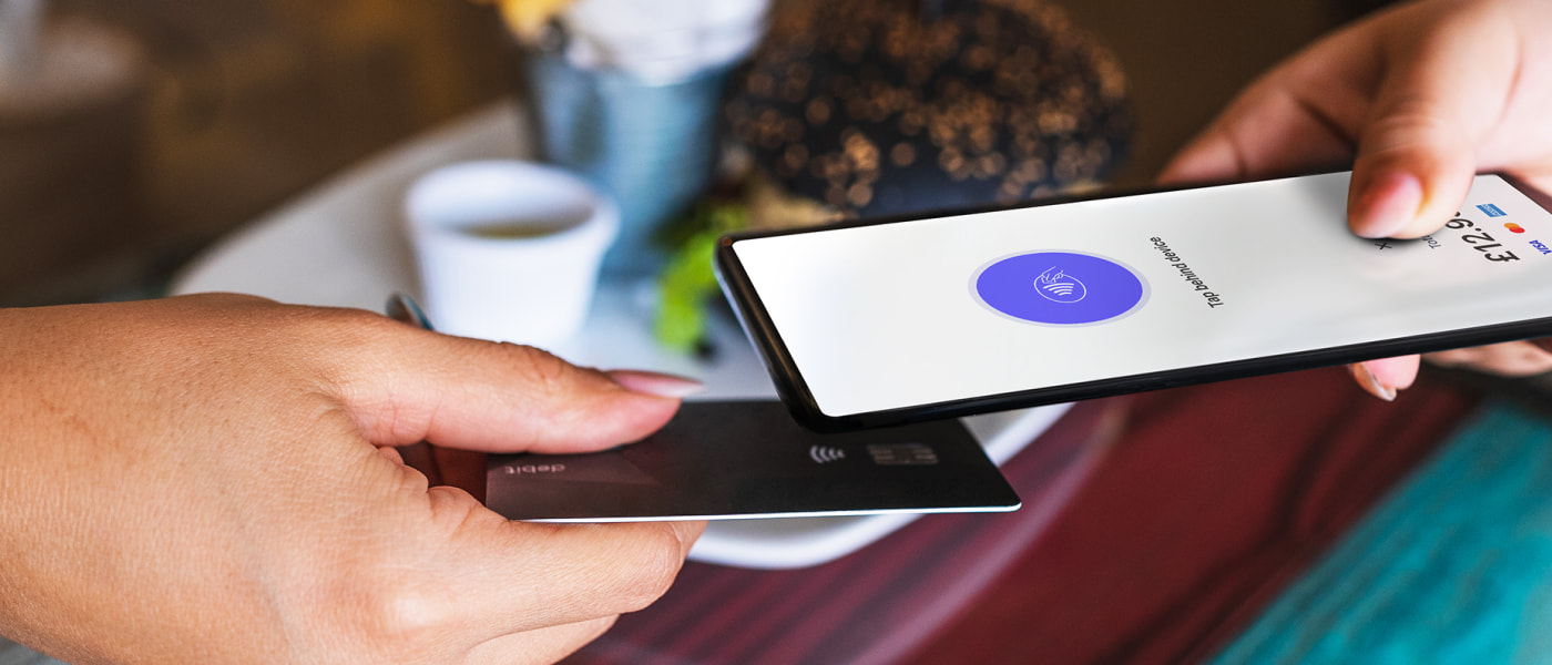 Person accepting contactless payment on Android with Lloyds Accept.