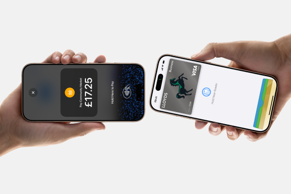 Person accepting contactless payment on iPhone with Lloyds Accept.