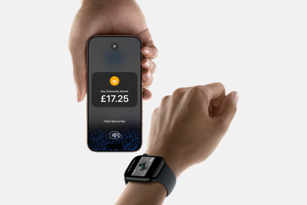 Person accepting contactless payment on iPhone with Lloyds Accept.