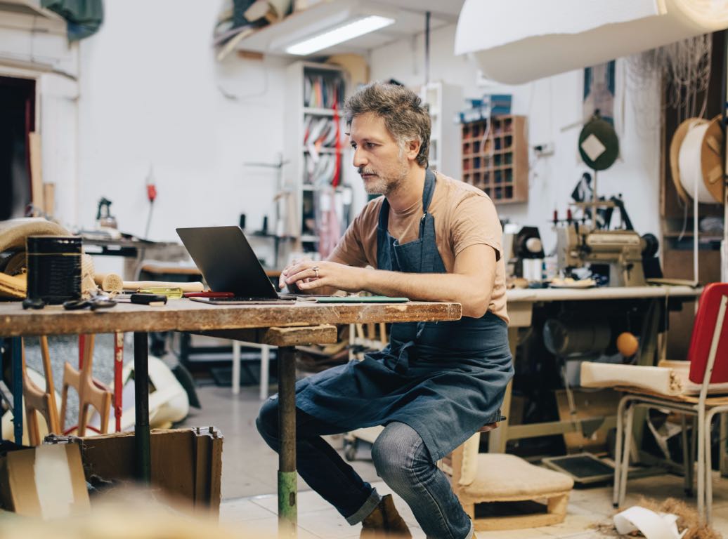 Small business completing a payment online using a laptop.