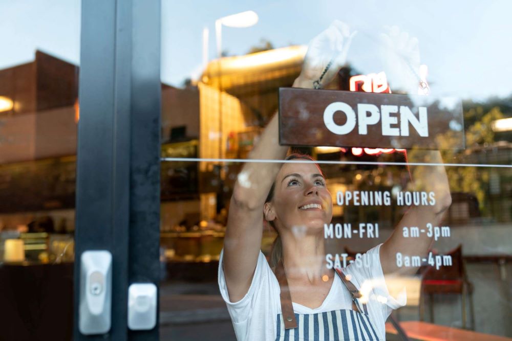 Image of Café owner opening up