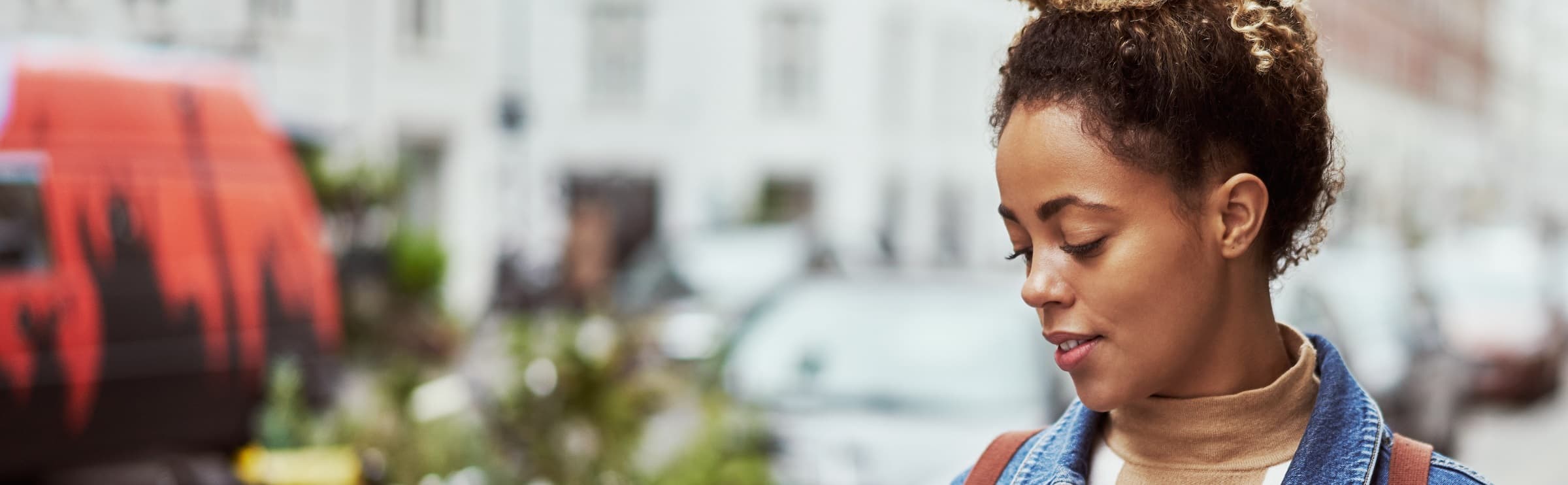 Banner of lady looking down at her phone