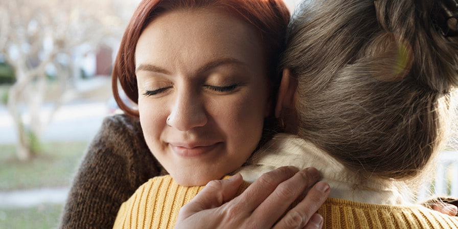 A white woman hugging