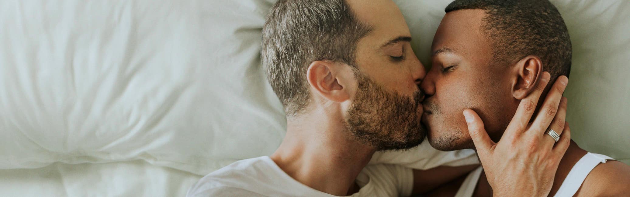 Two men kissing
