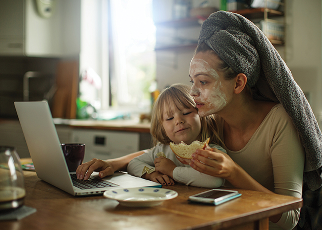 Woman and child with laptop