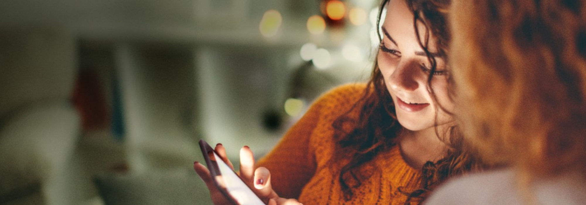 Women looking down on phone