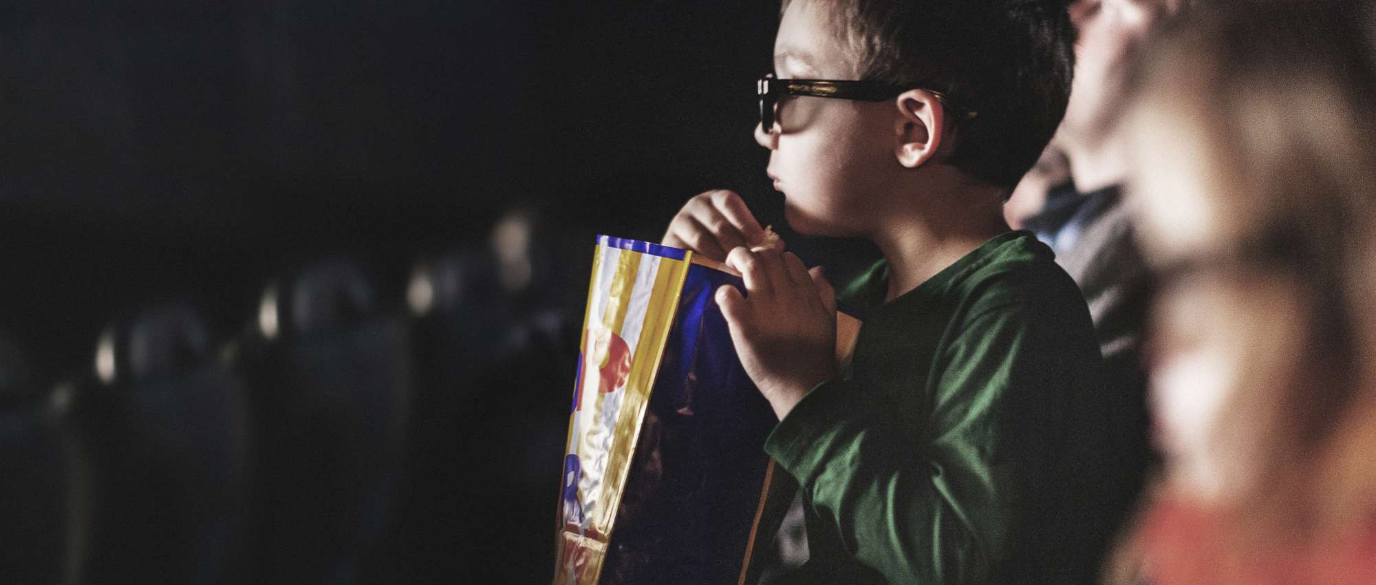 Boy eating popcorn