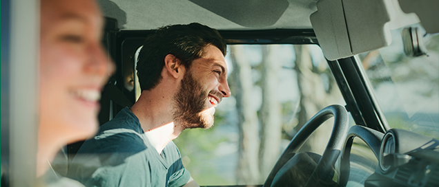 A smiling couple in a car