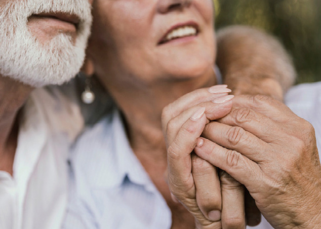man relaxing back listening on headphones.