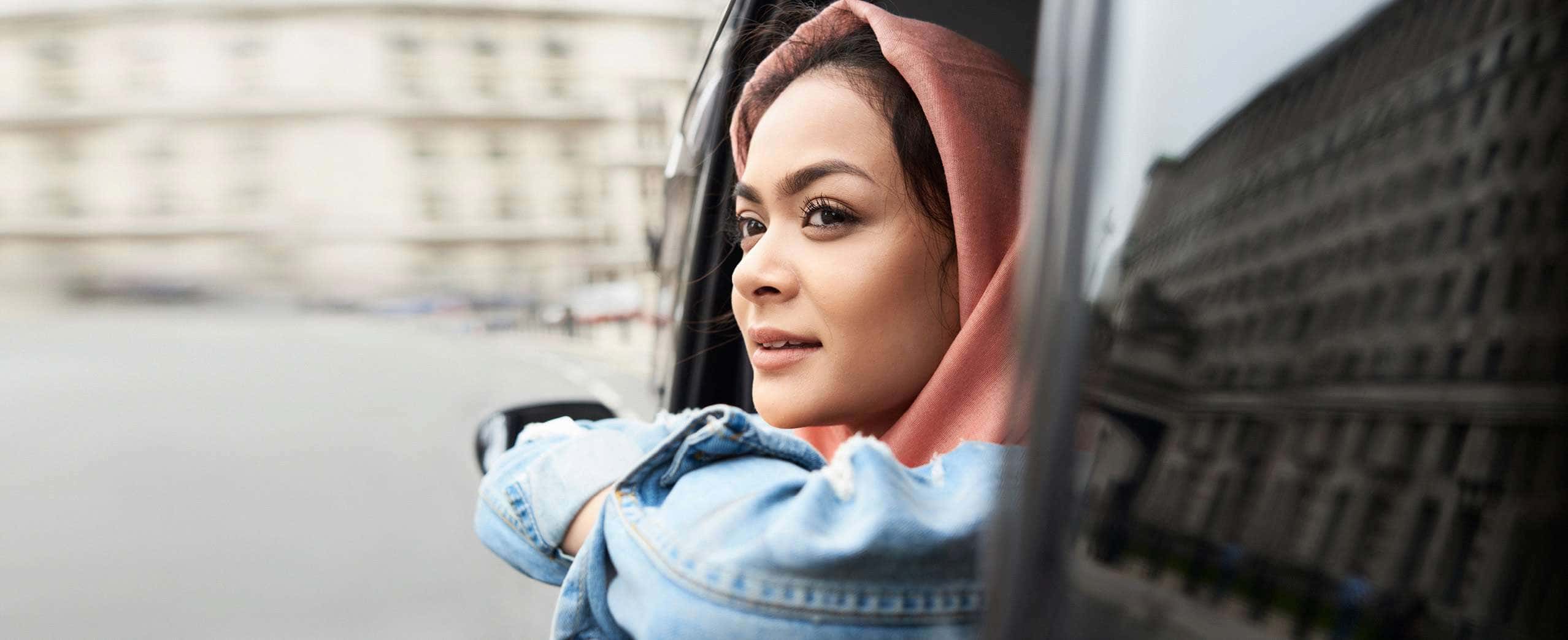 Person looking out of car.