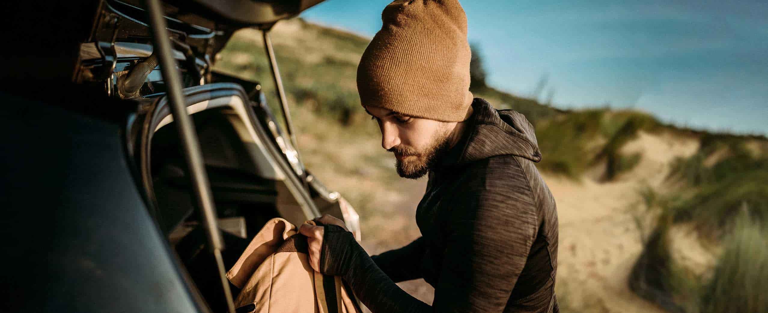 man packing book