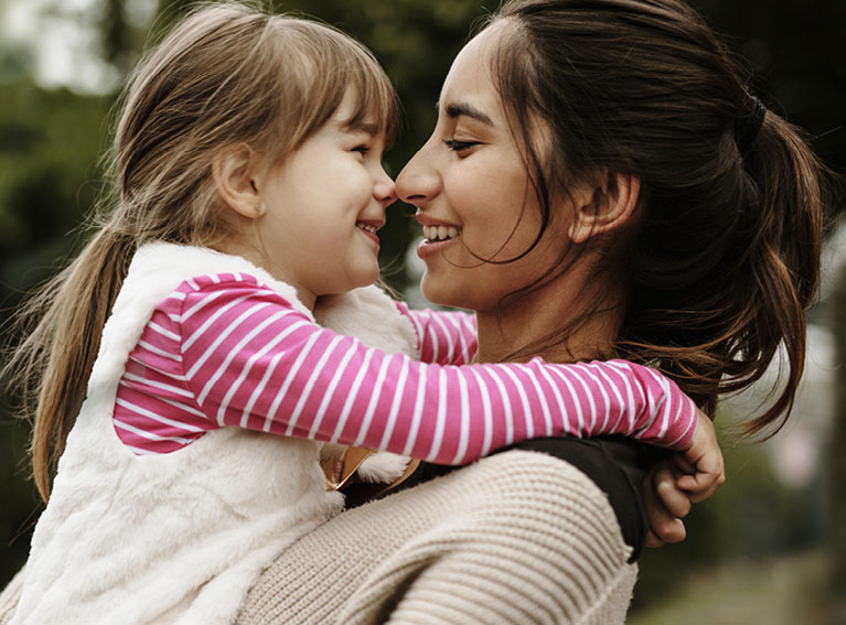 Mother and daughter embrace