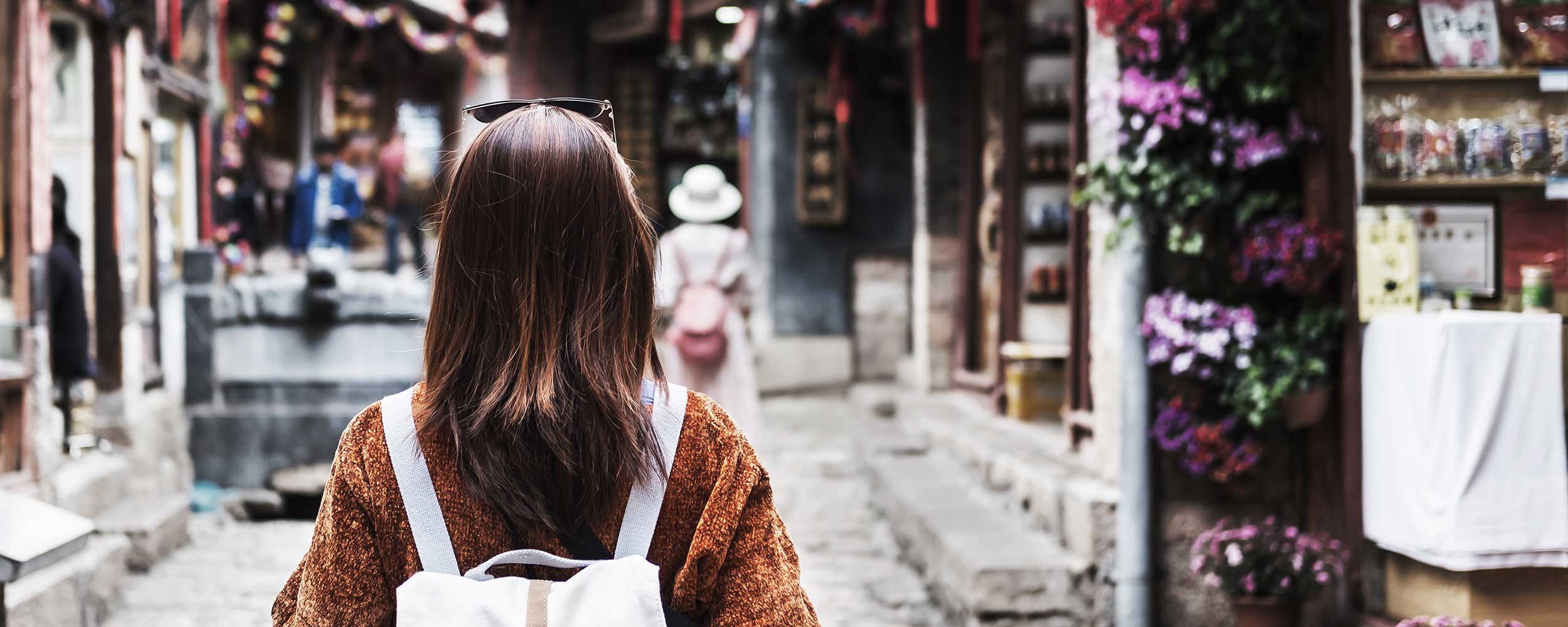 Woman walking down a street
