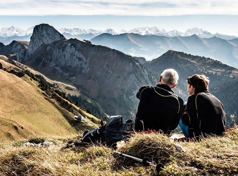 two men sat on moutain image