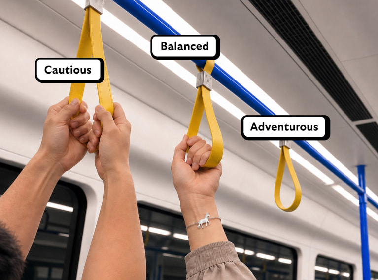 Hanging straps in an underground carriage. One person is holding on with both hands, one is holding on with hand, one is not holding on at all.