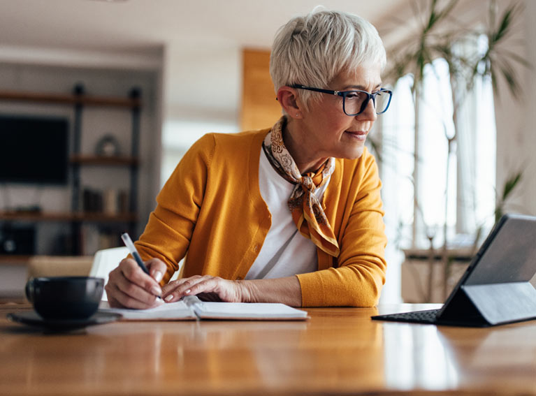 Woman looking at laptop.