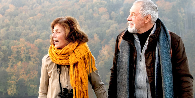 Man and woman walking in countryside.