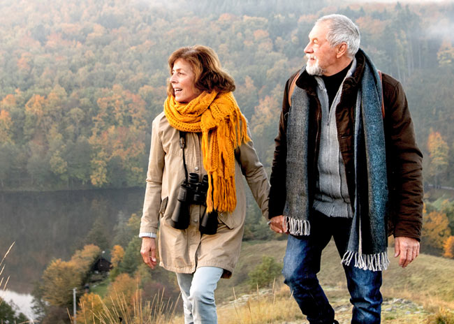 Man and woman walking in countryside.