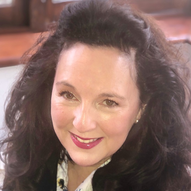 Head shot of Julie Ronaldson. Shoulder length curly brunette hair.
nh6jukhnm b