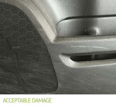 Acceptable damage - small scuff mark on interior door handle.