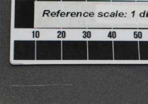 Image showing an acceptable scratch on the side of a car