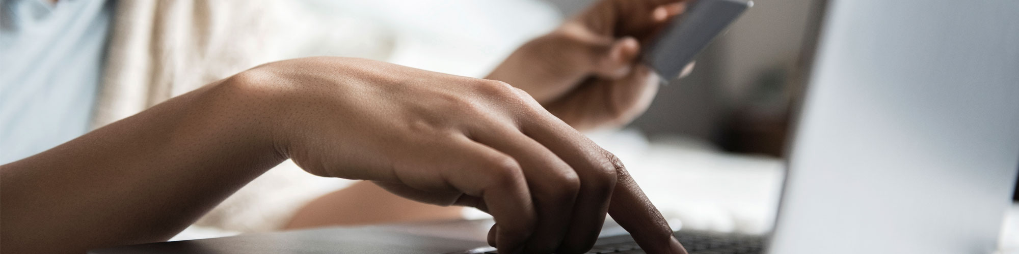 Hand on laptop