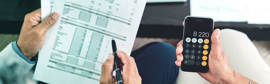 Couple working out their mortgage costs and fees.