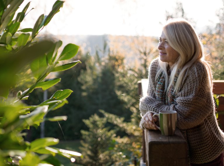 Woman with some greenery in the garden