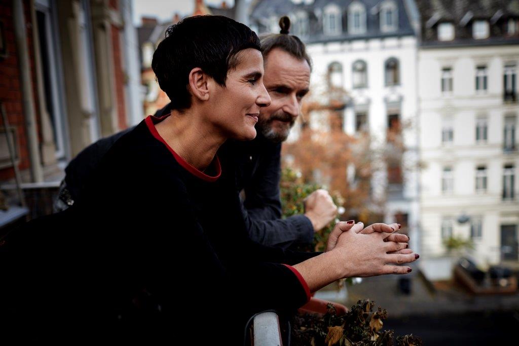 Man and woman on a balcony