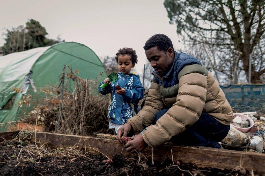 Man with child in garden
