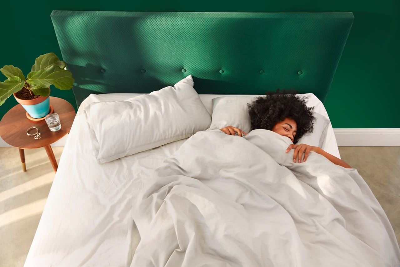 Person lying in bed, just waking up