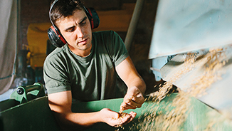 men with headphone in a factory