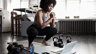 Young woman of colour working out